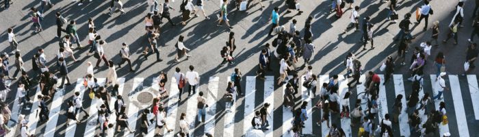 Aerial view photo of people crossing the road.
